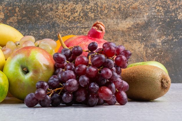 A variety of ripe fruits , on the marble.