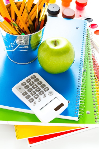 Variety of school supplies on a white background.