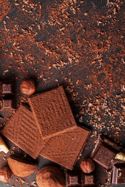 Variety of sweet homemade chocolate pralines on wooden background