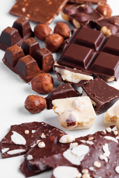 Variety of sweet homemade chocolate pralines on wooden background