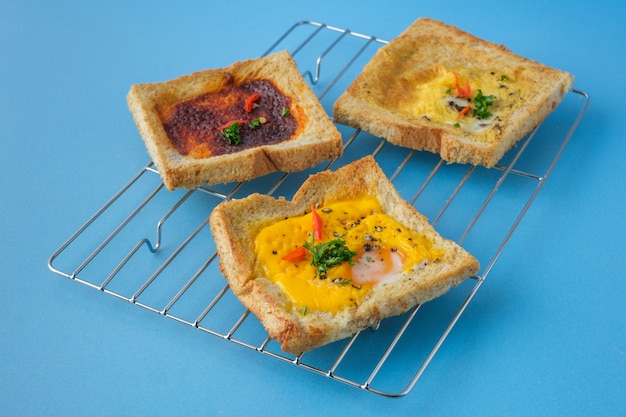 Variety of toast bread with tasty toppings.