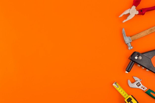 Variety of tools on an orange surface
