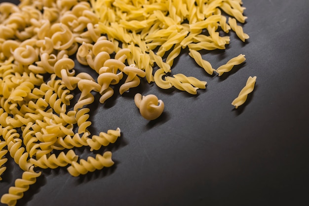 Variety of types of Italian pasta background