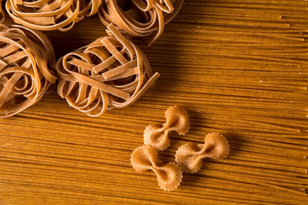 Variety of types and shapes of dry Italian integral pasta