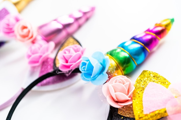 Variety of unicorn headbands on a white background.