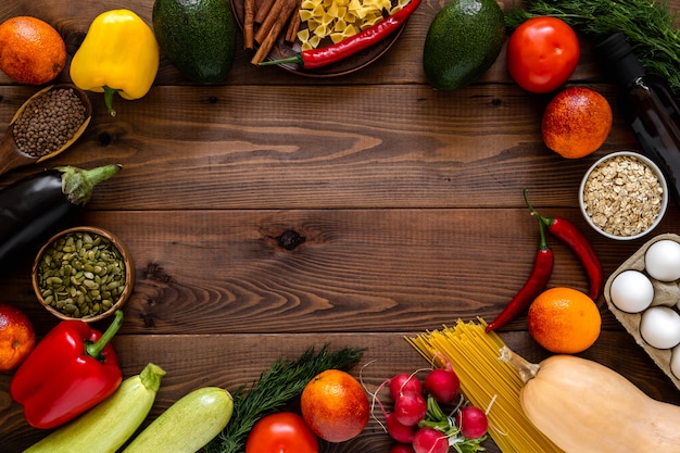 A Variety Of Vegetables Arranged On Wooden Background.