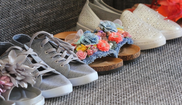 variety of woman fashion shoes sandal on gray background