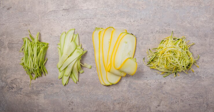 Variety zucchini vegetable noodles courgette spaghetti over gray