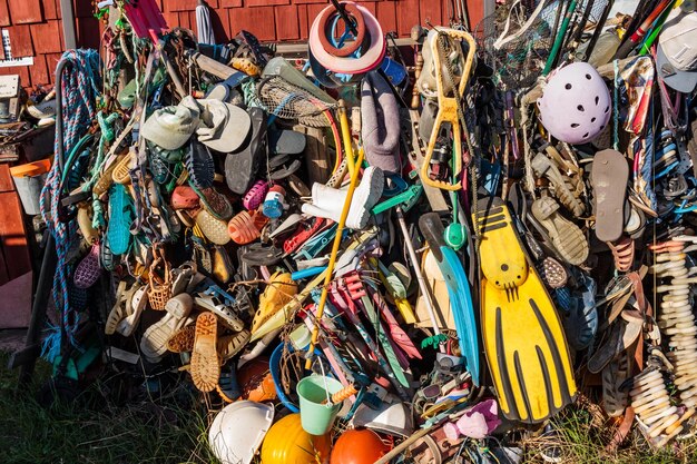 Various abandoned objects hanging at junkyard