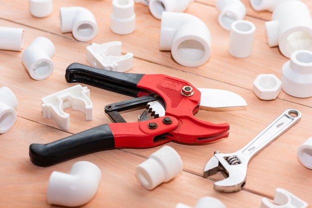 Various adapters, corners, plastic taps for water supply and repair of polypropylene pipes.