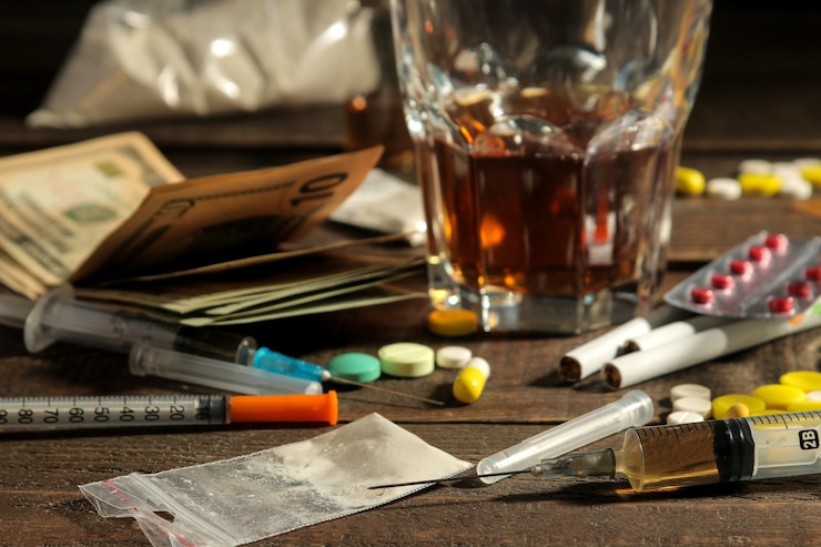 Photo various addictive drugs including alcohol, cigarettes, and drugs on a brown wooden table. drug addiction concept