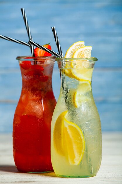 Various alcoholic cocktails on white background