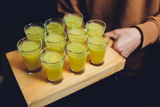 Various alcoholic shots in shot glasses in a serving tray often used for offers in the drinks industry