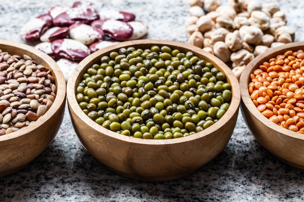 Various assortment of indian legumes - lentils, green orid dal, red double beans, white lobia.