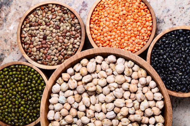 Various assortment of legumes - beans, chickpeas, lentils, black  and green orid dal. Vegetable proteins.