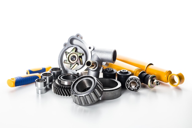 various automotive parts and components arranged for display in a studio setting