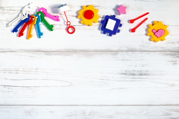 Various baby toys on wooden table