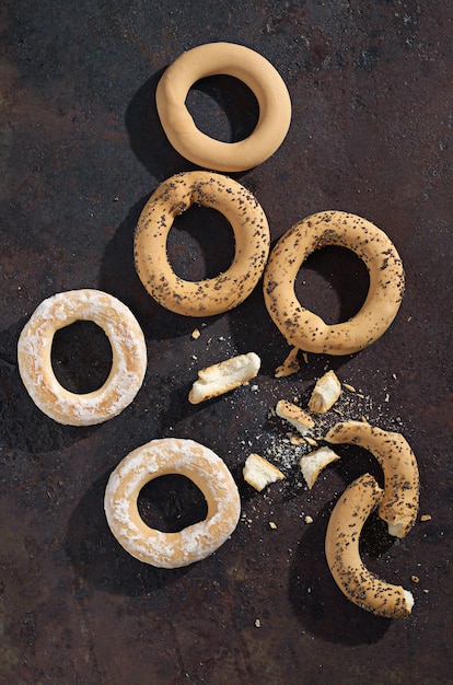 Various bagels on a stone table