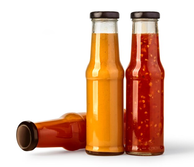 the various barbecue sauces in glass bottles