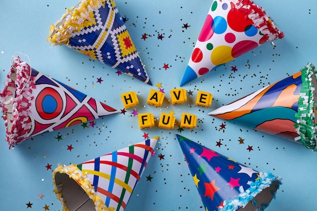 various birthday cones with confetti on blue background