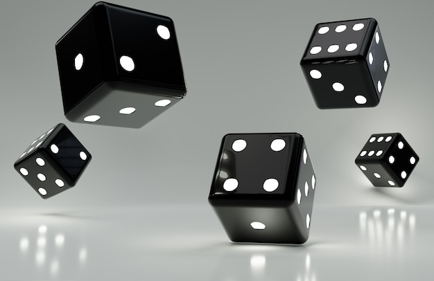 Various black dice on glossy gray surface