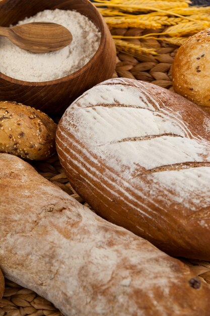 Various bread loaves with flour