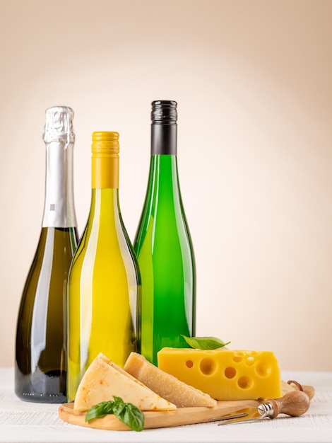 Various cheese on board and white wine