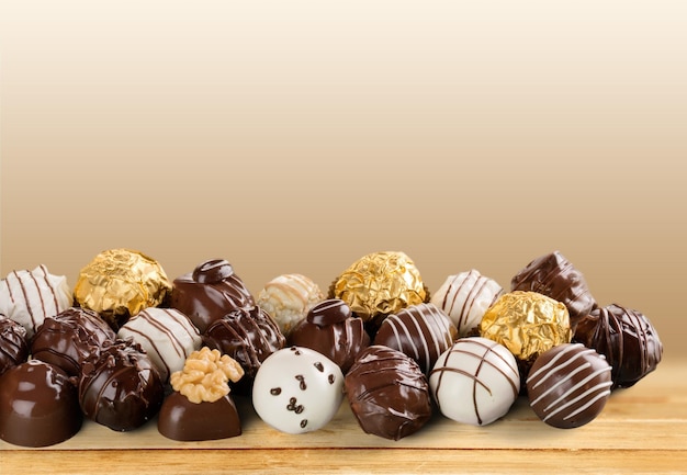 Various chocolate candies on  background