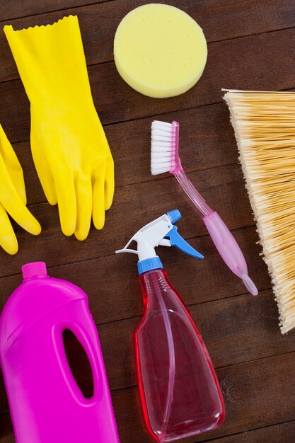 Various cleaning equipment arranged on wooden floor