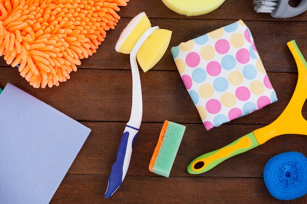 Various cleaning equipment arranged on wooden floor