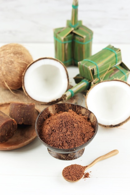 Various Coconut Palm Sugar Granule and Block Natural Brown Sugar on White Table