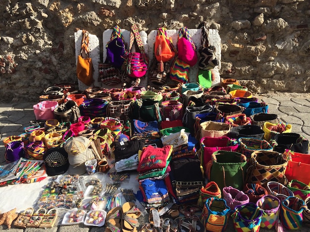 Photo various colorful bags at market for sale