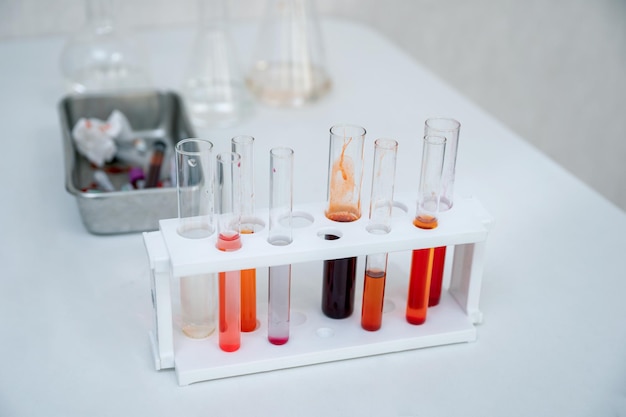 Various colors chemical test tubes in rack at lab