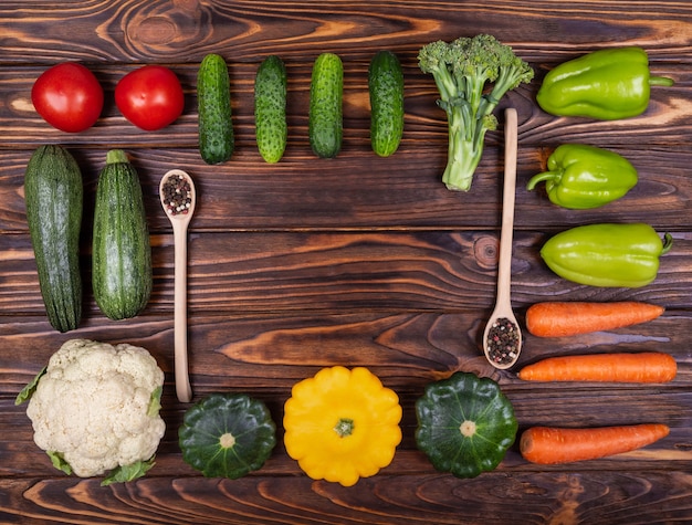 Photo various colourful vegetables on wooden background food knolling