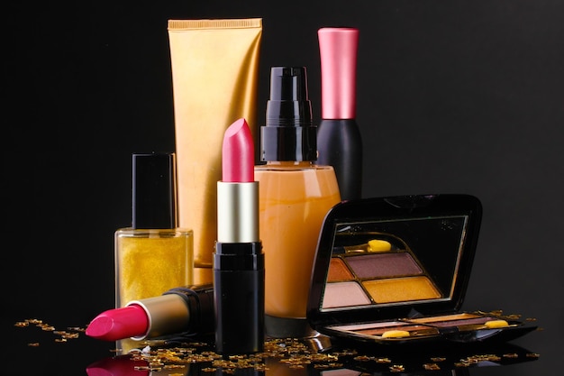 Various Cosmetic Products on Dark Background