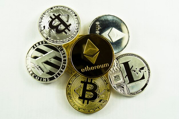 Various crypto-currents bitcoin, lightcoin, ethereum on a white background