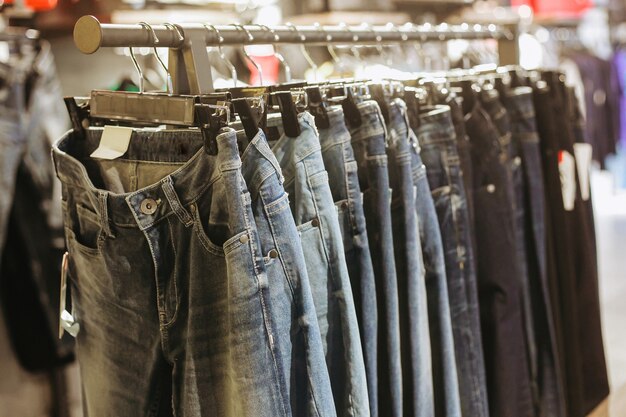 Premium Photo  Jeans shorts on the store shelf. fashionable clothes on the  shelves in the store