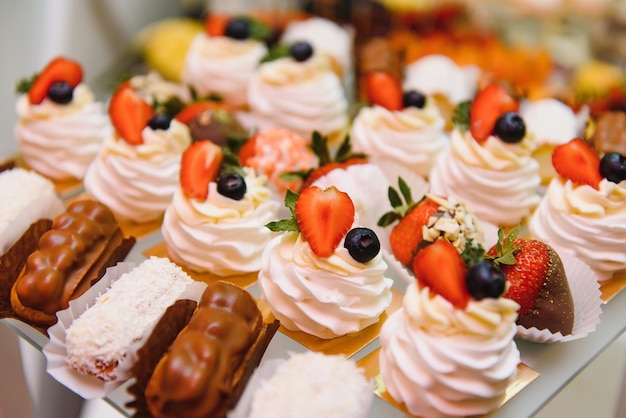 Various dessert with fresh fruit on buffet line sweet