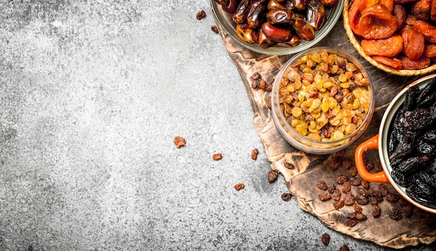 Various dried fruit in bowls.