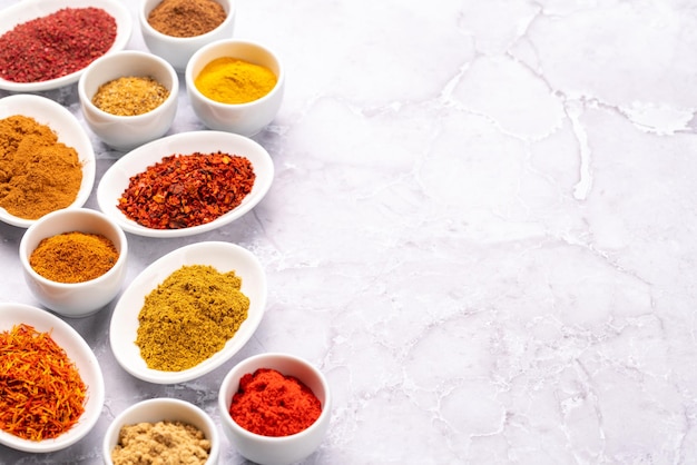 Various dried spices in small bowls