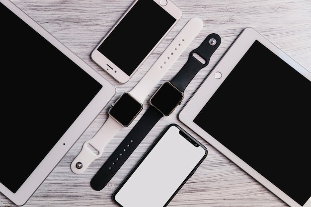 Various electronic gadgets on wooden background