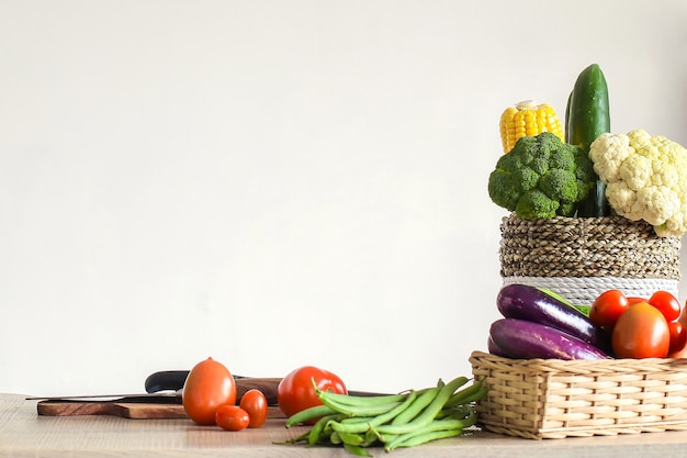 Various of fresh colorful vegetables on kitchen table ready to cook