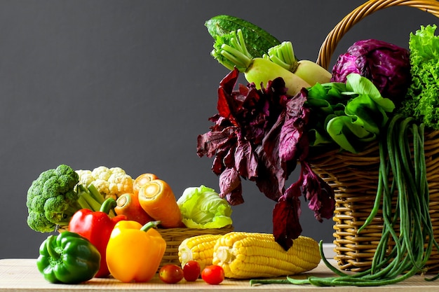 Various of fresh colorful vegetables on wooden table