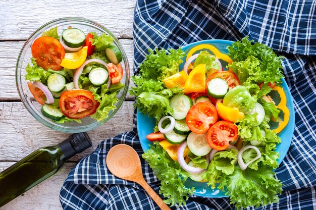 Various fresh mix salad with tomato, cucumber, onion, bell pepper, healthy food and diet m