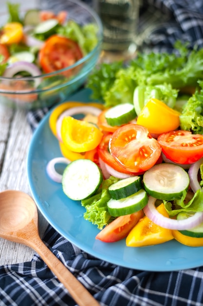 Various fresh mix salad with tomato, cucumber, onion, bell pepper, healthy food and diet m