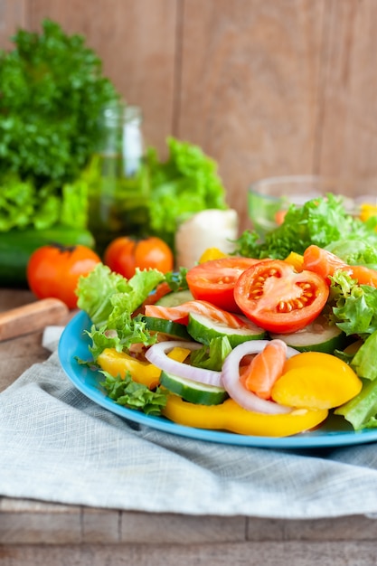 Various fresh mix salad with tomato, cucumber, onion, bell pepper, healthy food and diet m