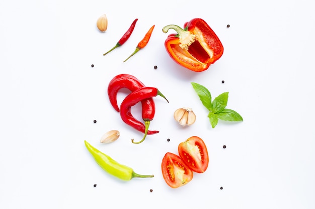 Various fresh vegetables and herbs on white background. 