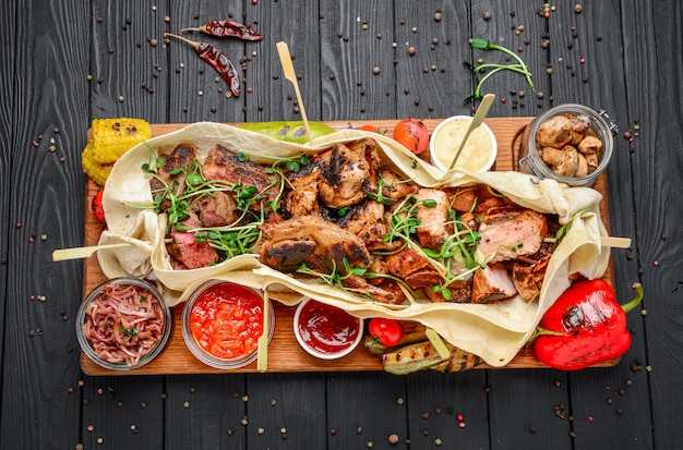 Various fried grilled meat snacks with various sauces