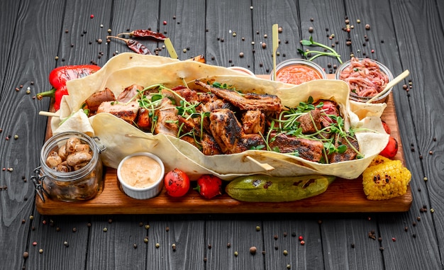 Various fried grilled meat snacks with various sauces