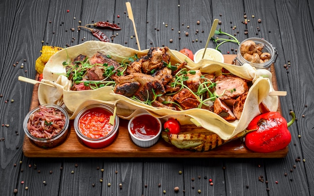 Various fried grilled meat snacks with various sauces